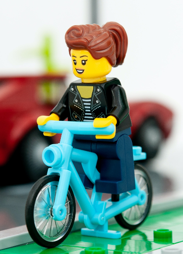 lego figure on bike